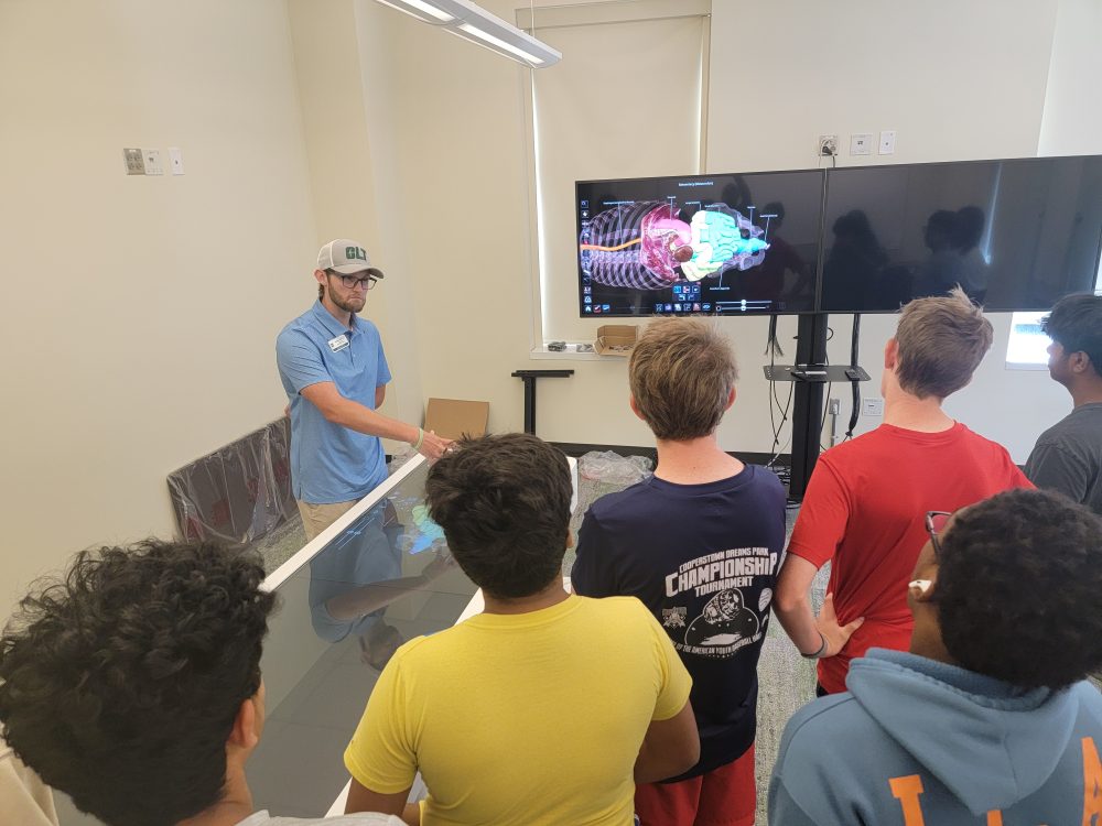 Joshua Harris, Graduate Student, shares views of the human body using an Anatomage Table.